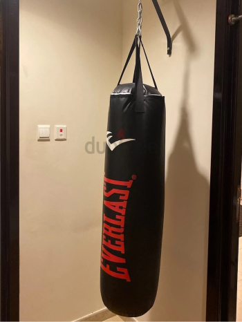 Kick boxing babe with wall hanger